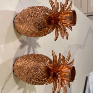 candle stick holders from anthropologie in bronze new. shape of a pineapple
